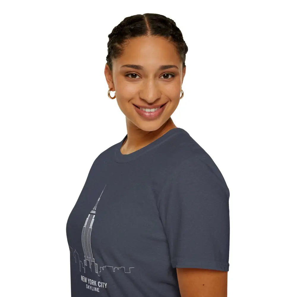 Woman wearing a dark blue unisex softstyle t-shirt with NYC skyline graphic and ribbed knit collar