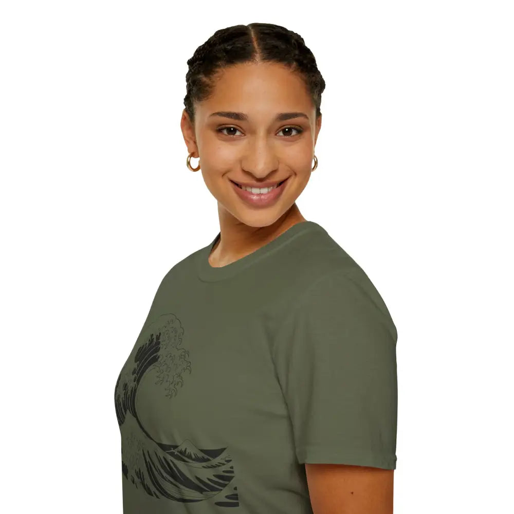 Woman with braided hair wearing olive green unisex t-shirt with black wave graphic