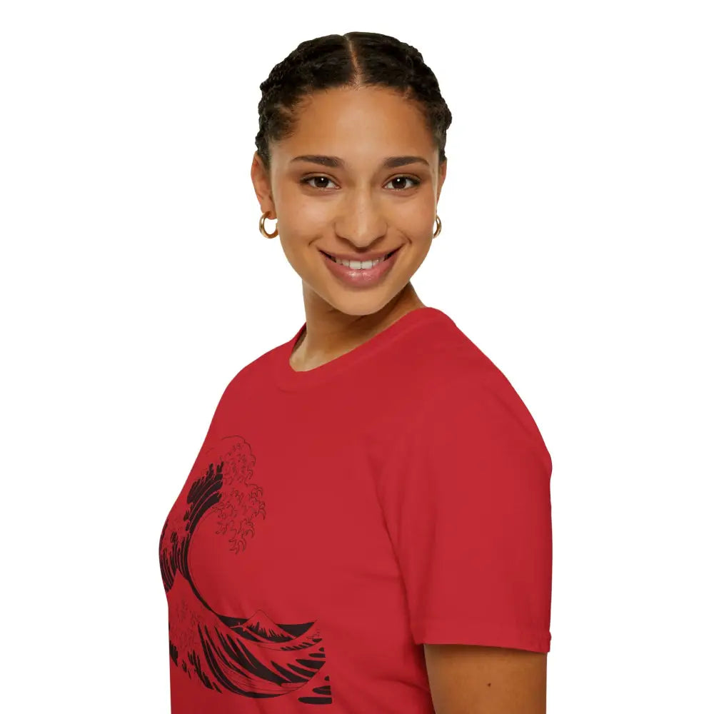 Woman wearing a red unisex t-shirt with black wave design, highly elastic ribbed fabric
