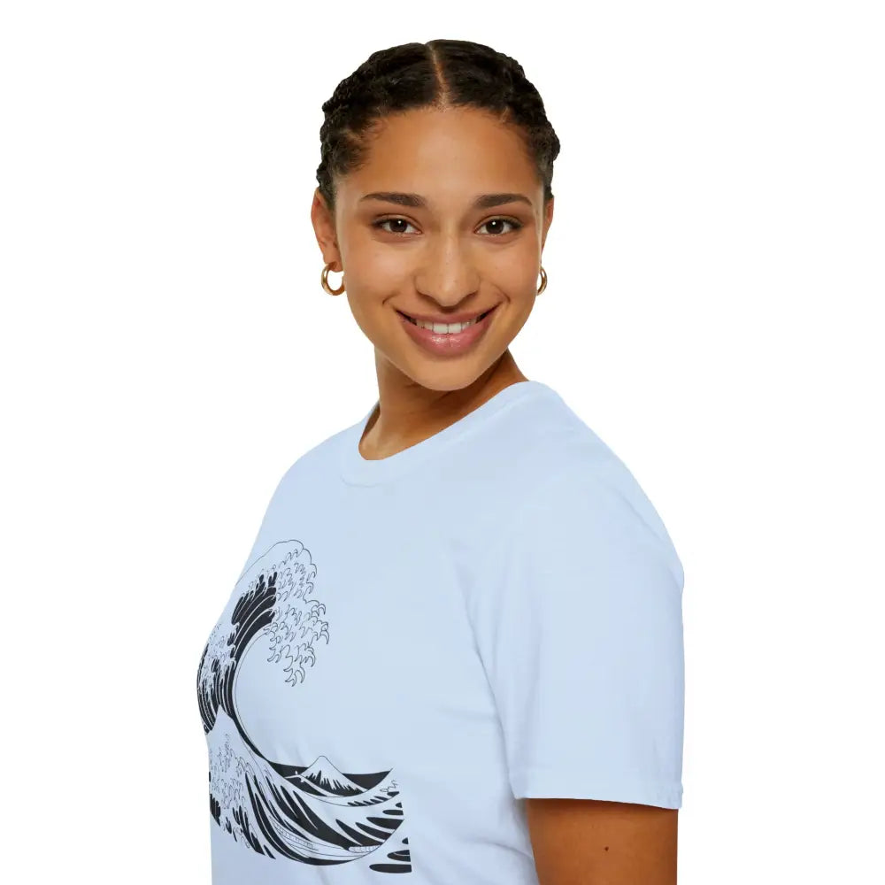 Woman in a light blue unisex t-shirt with a wave design, highly elastic ribbed fabric