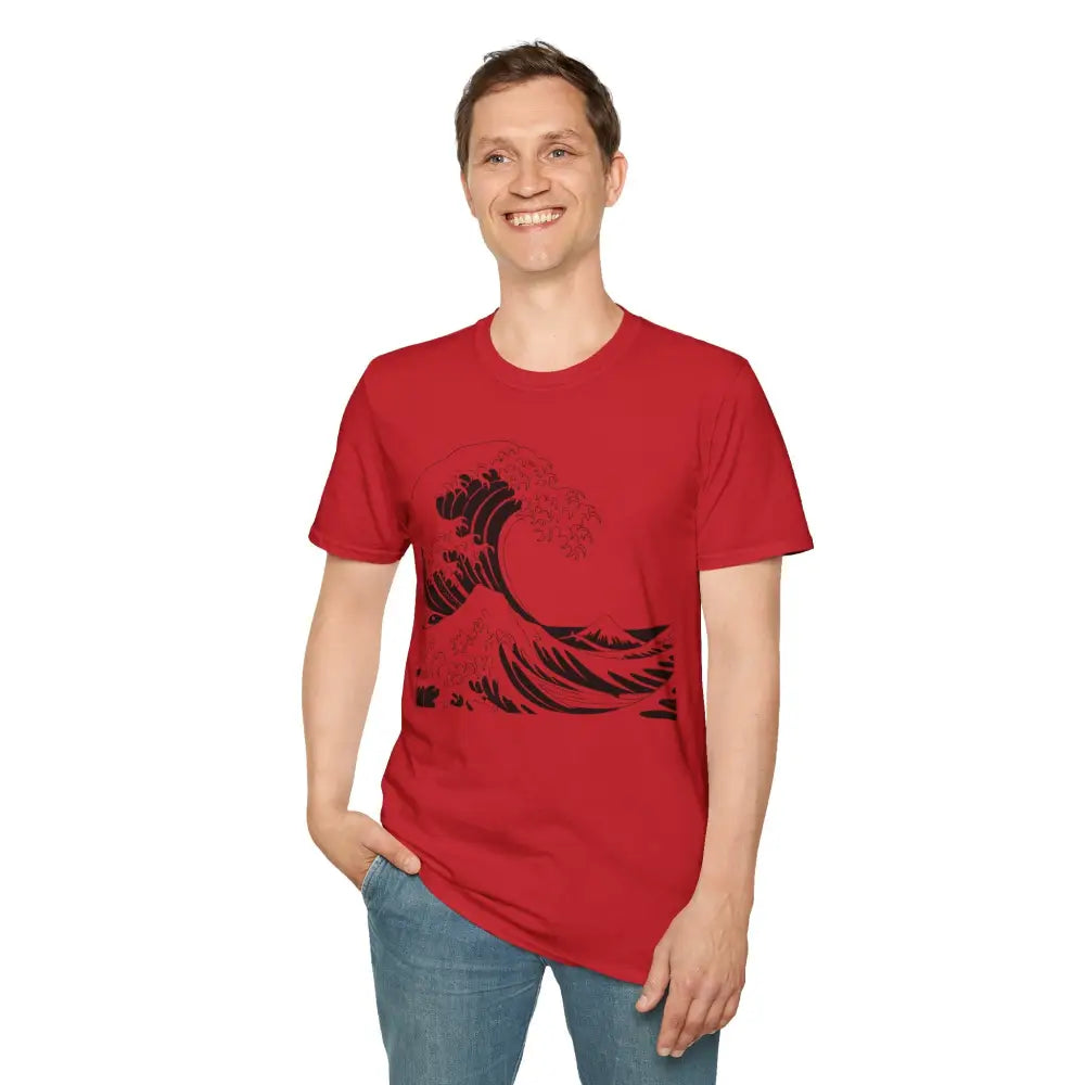 Man wearing ocean wave unisex t-shirt with black wave graphic and blue jeans