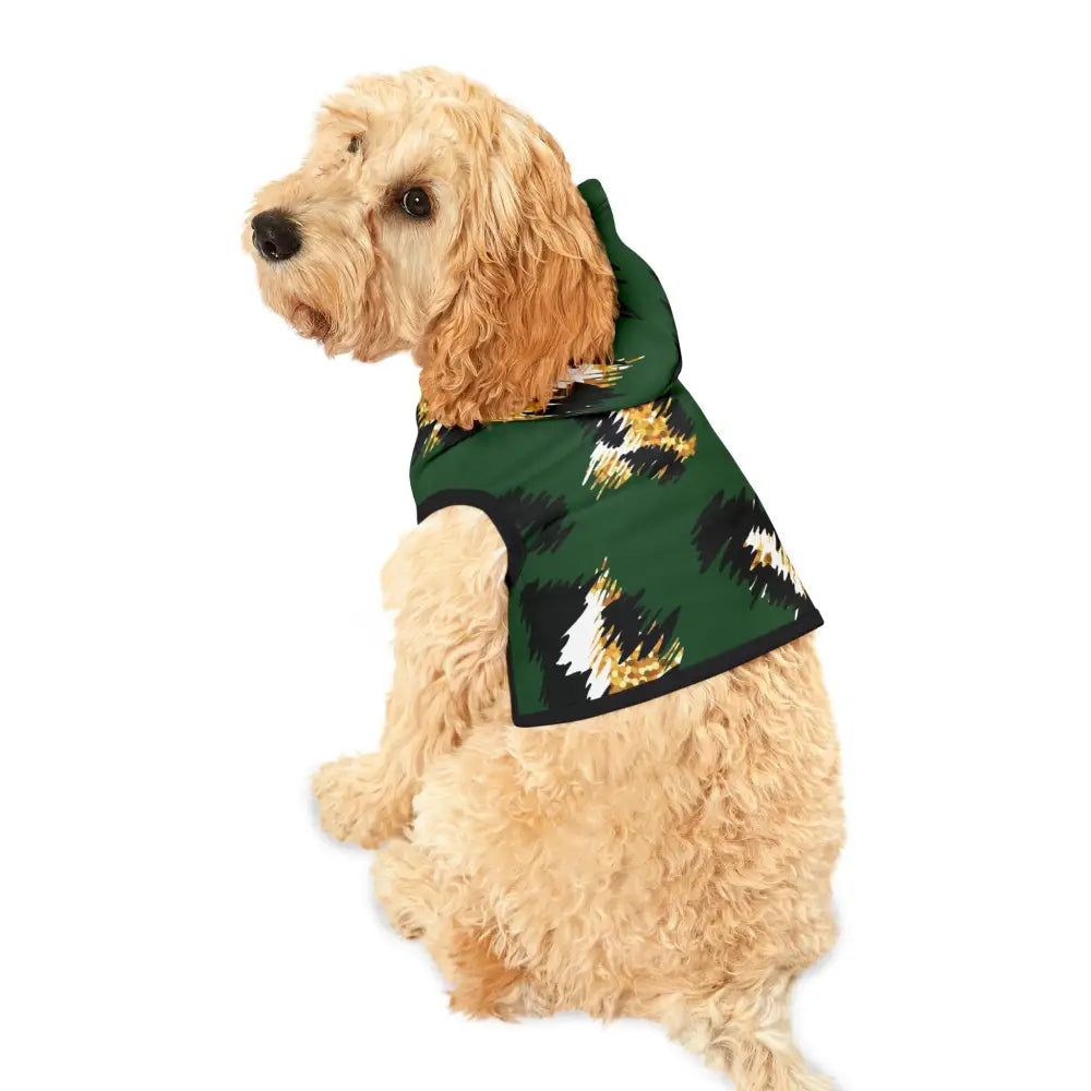 Dog wearing a green patterned hoodie from PixiOnyx Bold Petwear Skyhawk Forest Camo collection
