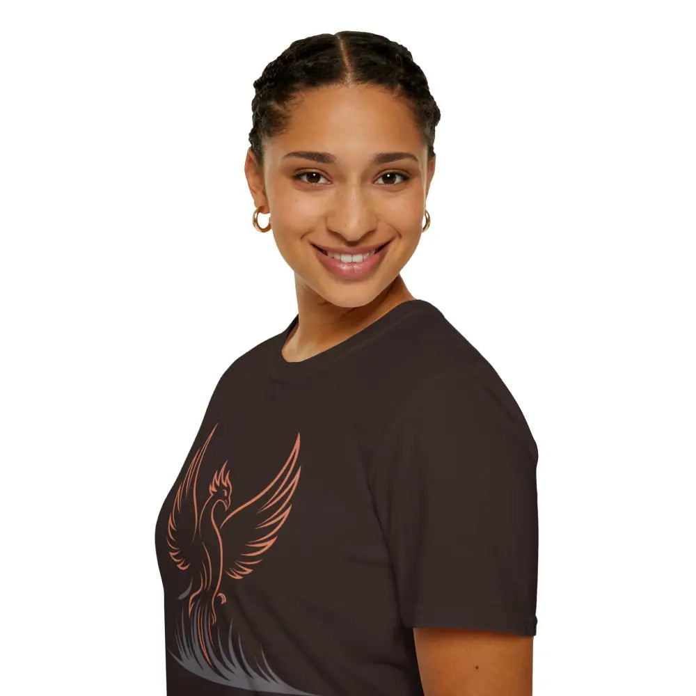 Woman wearing a dark brown Phoenix Rising T-Shirt with pink phoenix graphic, eco-friendly design