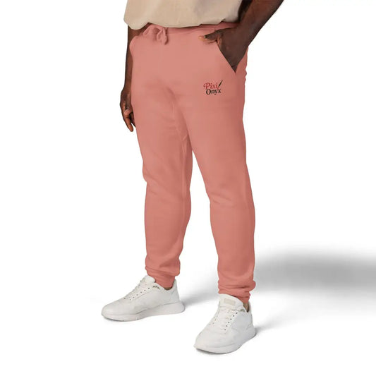 Coral-colored unisex fleece sweatpants with drawstring waist for cozy relaxation and casual wear