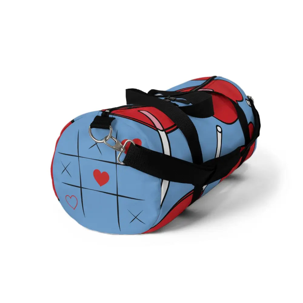 Blue and red stylish duffel bag with tic-tac-toe design and black straps for travel or gym