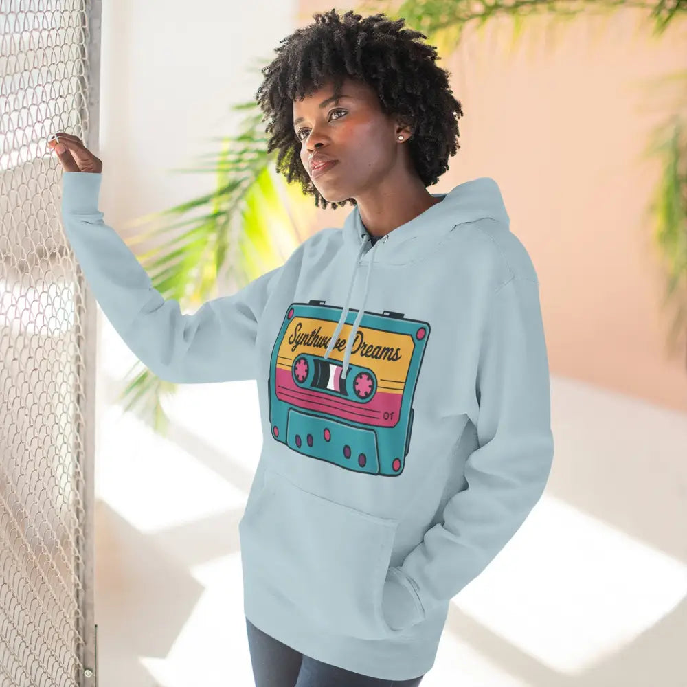 Woman in light blue hoodie with colorful cassette tape graphic, vintage music style, machine wash max 30c