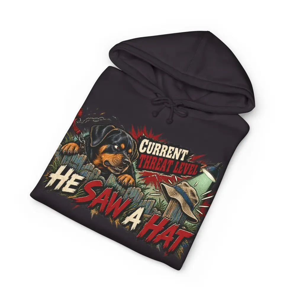 Black unisex hoodie with ribbed cuffs featuring bold rottweiler graphic and care instructions tear away label