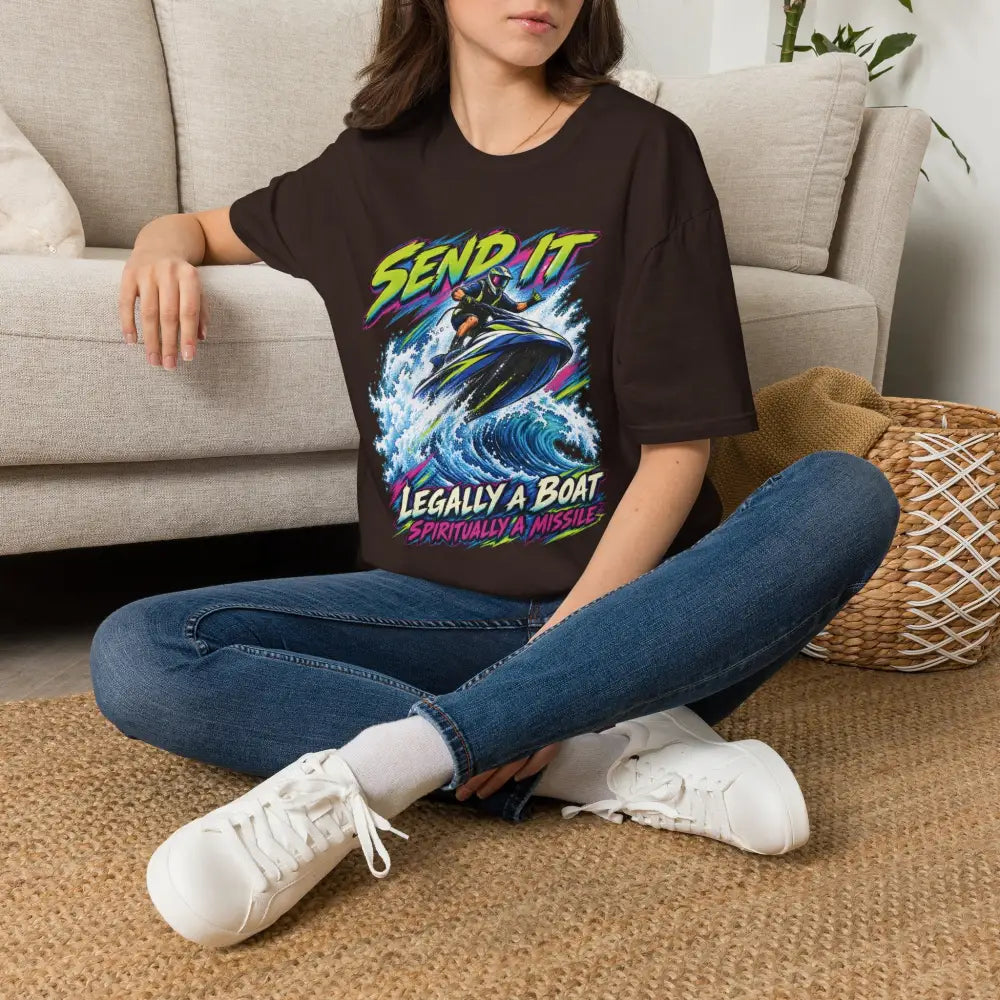 Black oversized unisex t-shirt with neon jet ski rider graphic and send it legally a boat spiritually a missile text low heat care instructions tumble dry