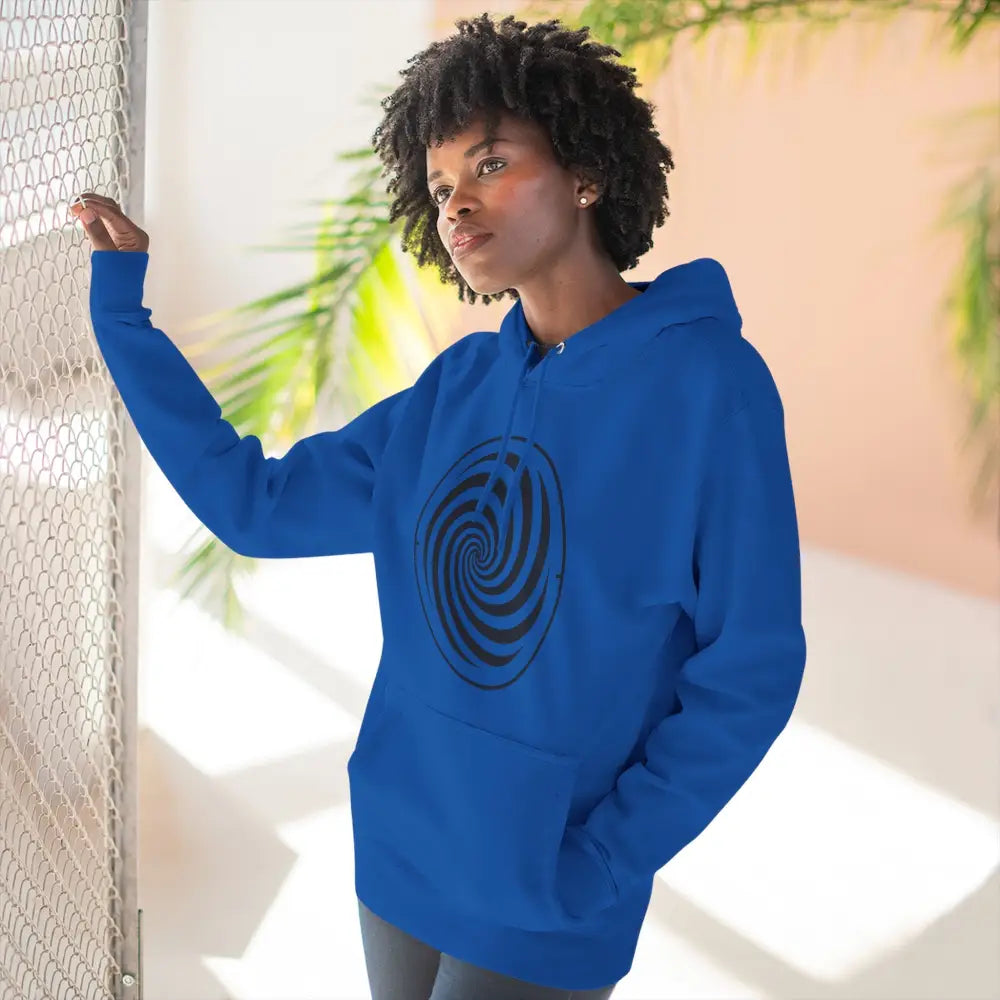 Woman wearing royal blue fleece hoodie with black spiral design and spacious kangaroo pocket
