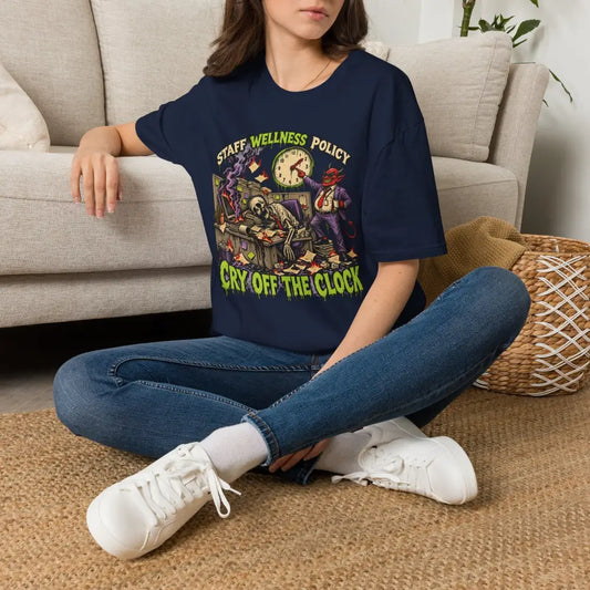 Navy blue short-sleeved staff wellness policy t-shirt with colorful devil skeleton clock graphic and low heat care instructions