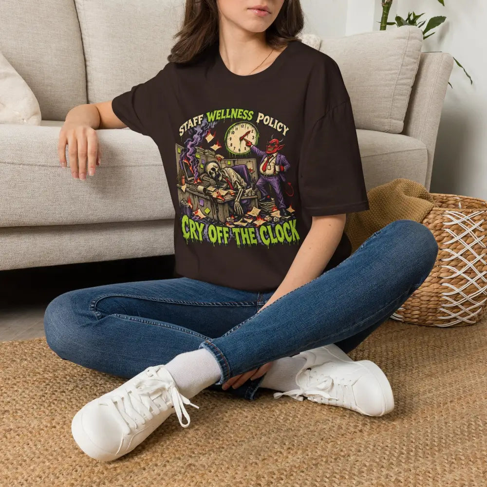 Black t-shirt with colorful skeleton and demon graphic and wellness policy text care instructions recommend low heat