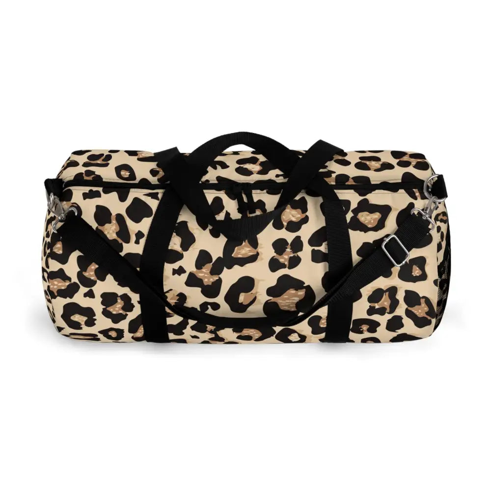 Chic leopard print duffel bag with black handles, adjustable shoulder strap, and internal zipper pocket