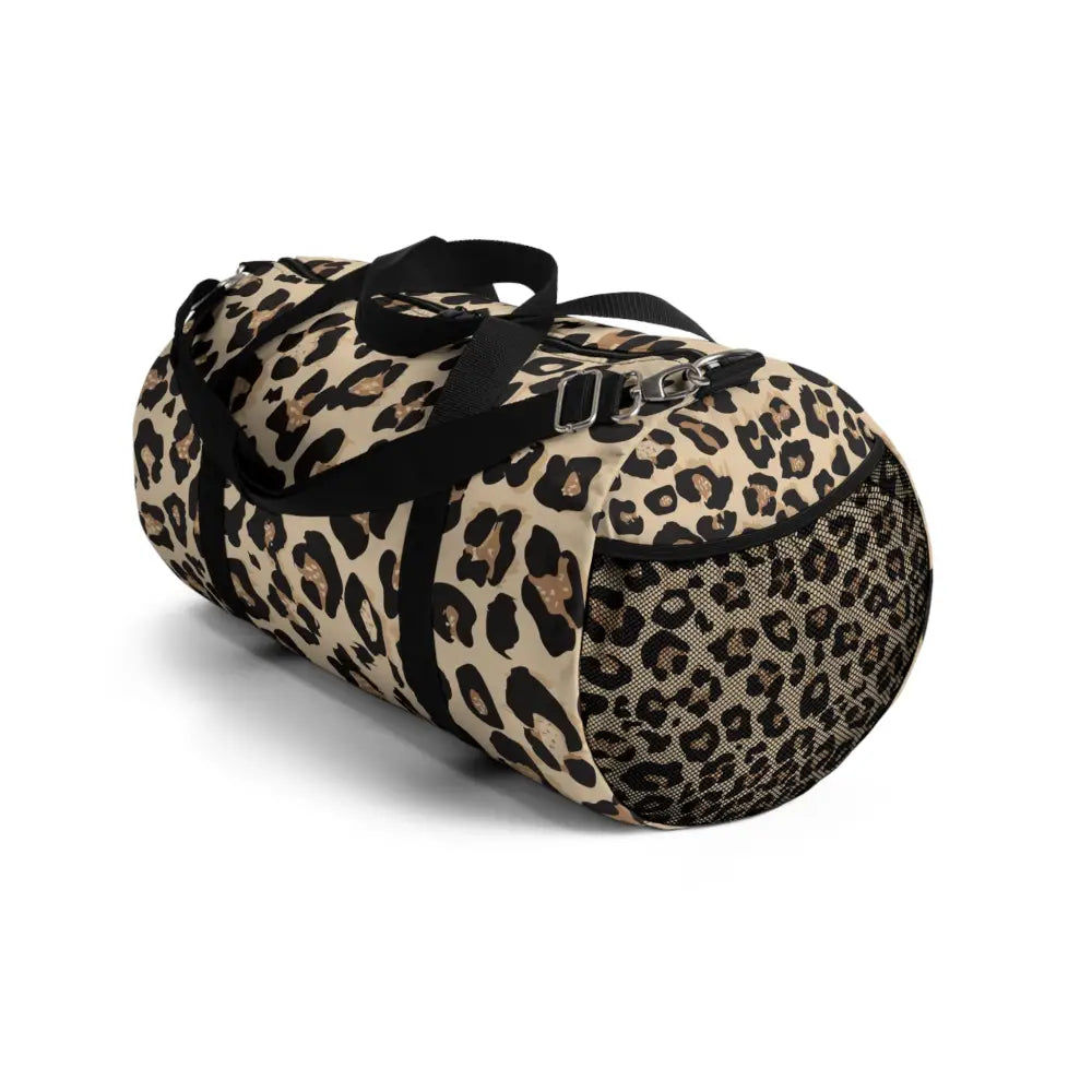 Chic leopard print duffel bag with black handles, mesh side pocket, and adjustable shoulder strap
