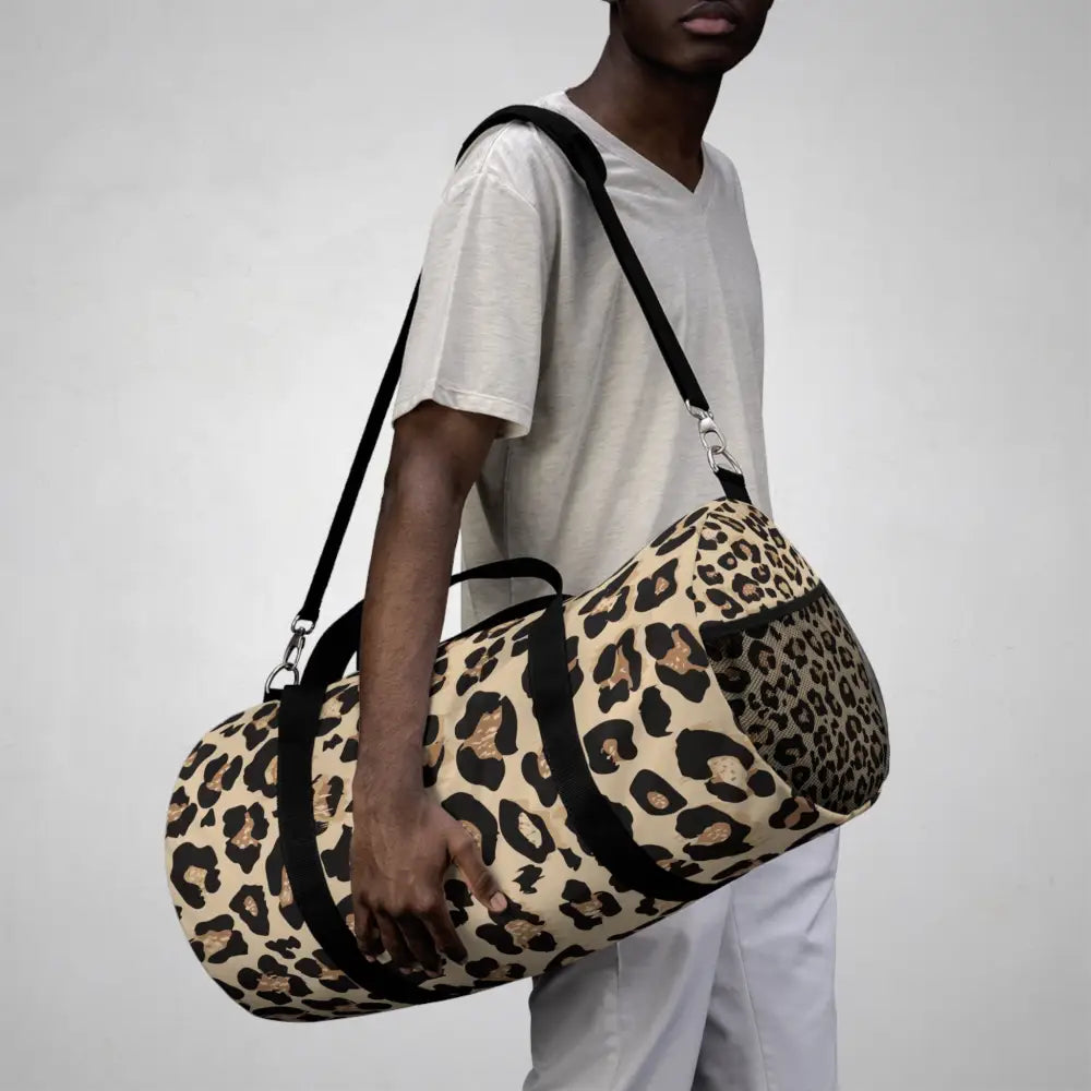 Chic leopard print duffel bag with adjustable shoulder strap and internal zipper pocket