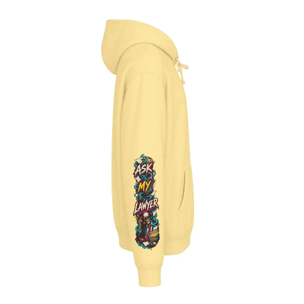 Unisex pale yellow heavyweight hooded sweatshirt featuring vibrant graffiti-style ask my lawyer graphic on left sleeve