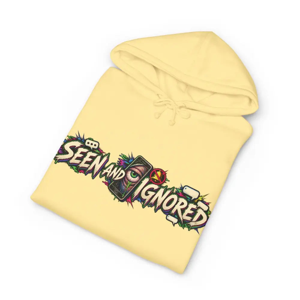 Pale yellow heavyweight hooded sweatshirt featuring a vibrant graffiti style family group graphic saying seen and ignored