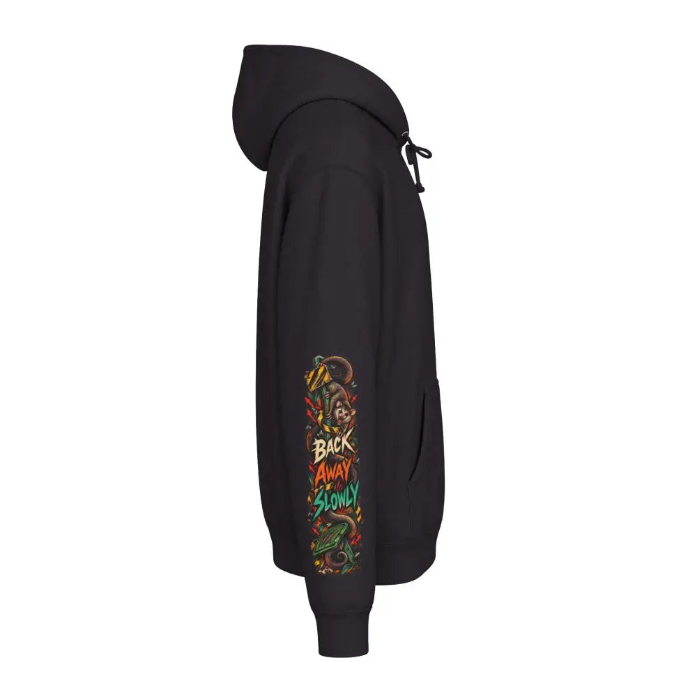 Black heavyweight hooded sweatshirt with colorful wildlife warning graphic on left sleeve for unisex use
