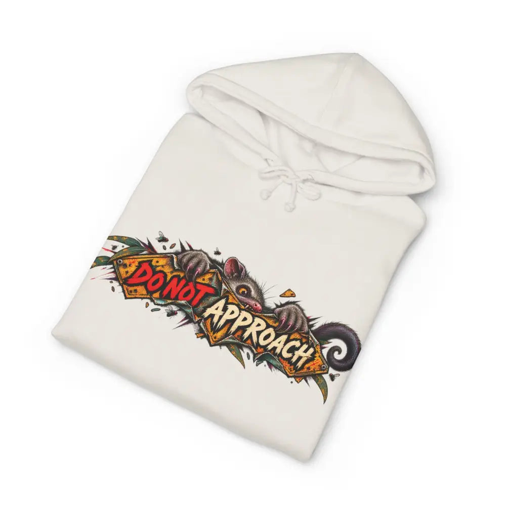 White heavyweight hooded sweatshirt with vibrant cartoon opossum and bold do not approach text on orange banner