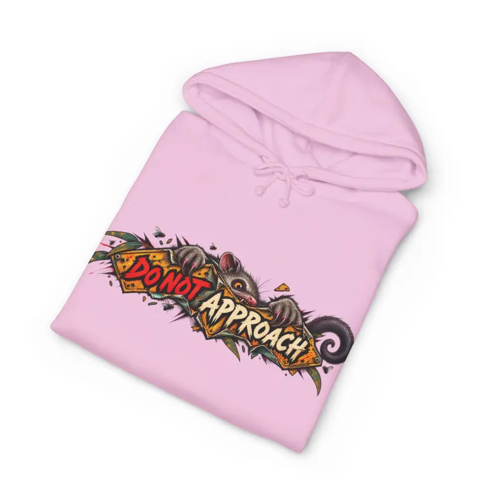 Pink heavyweight hooded sweatshirt with bold cartoon opossum holding a do not approach sign in red and yellow lettering