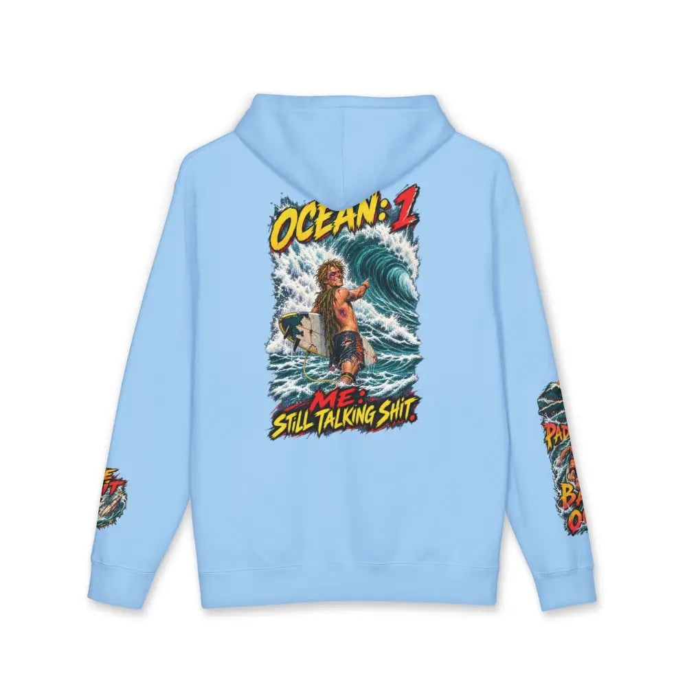 Light blue unisex surf hoodie with vibrant surfer graphic and ocean me still talking shit text machine wash max 30c care instructions