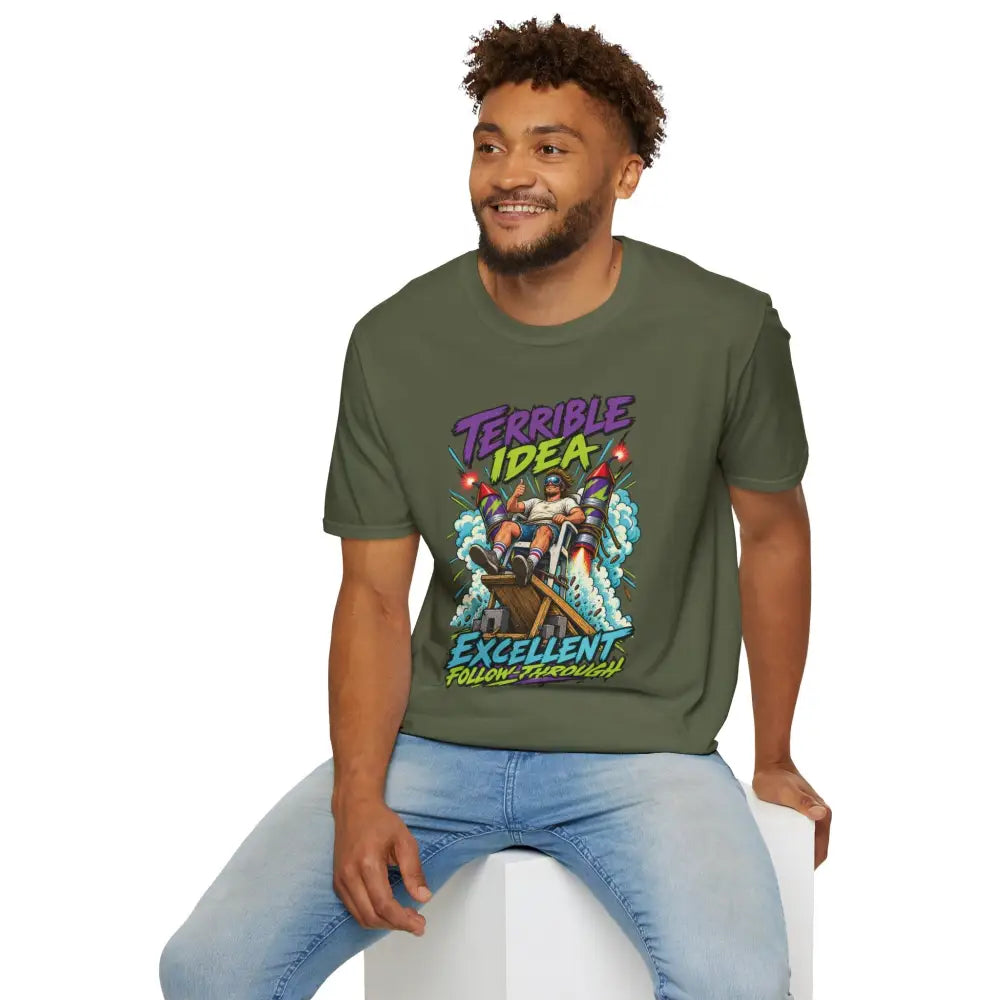 Olive green cotton unisex t-shirt with retro rocket graphic and terrible idea excellent follow-through text, low heat tumble dry care instructions