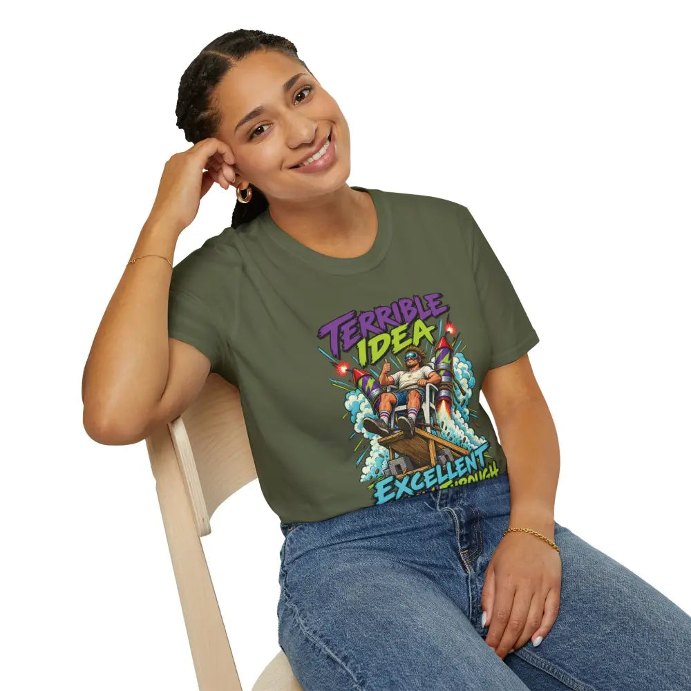 Olive green unisex t-shirt with retro rocket graphic saying terrible idea excellent follow-through low heat tumble dry care instructions