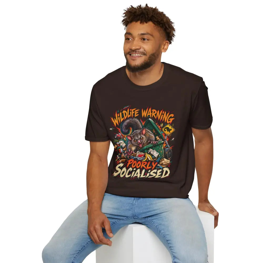 Unisex black ring-spun cotton t-shirt with colorful cartoon possum graphic and wildlife warning text low heat care instructions