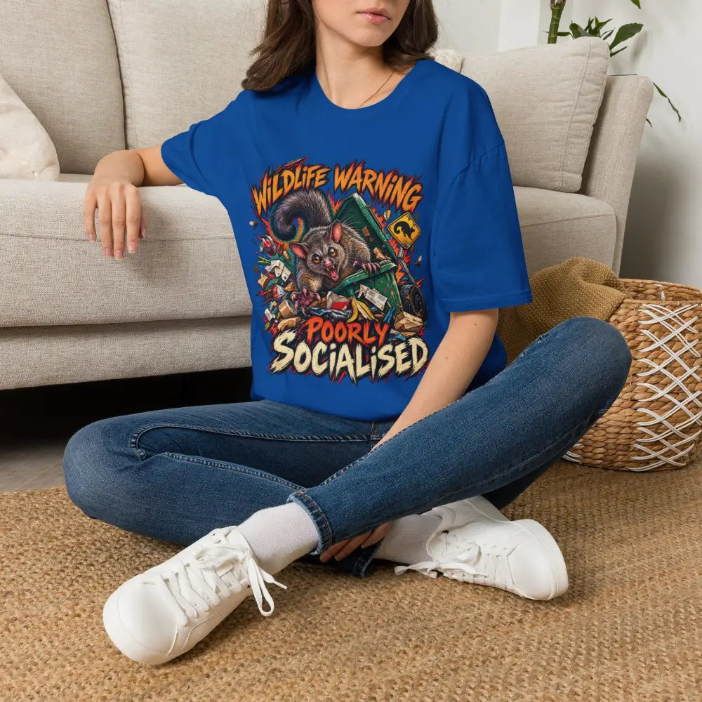 Unisex blue ring-spun cotton t-shirt with colorful marsupial graphic and wildlife warning text, care instructions low heat