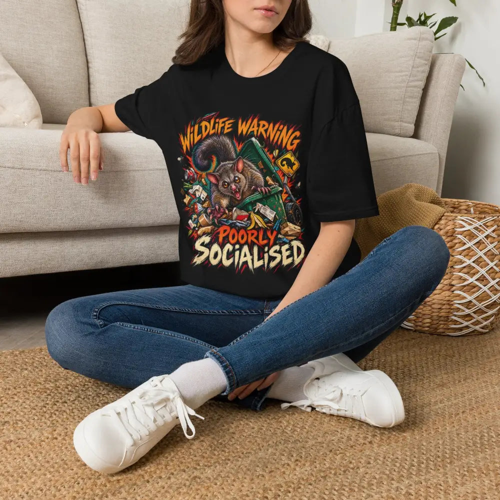 Unisex black short-sleeved t-shirt with colorful cartoon possum graphic wildlife warning design ring-spun cotton care instructions low heat
