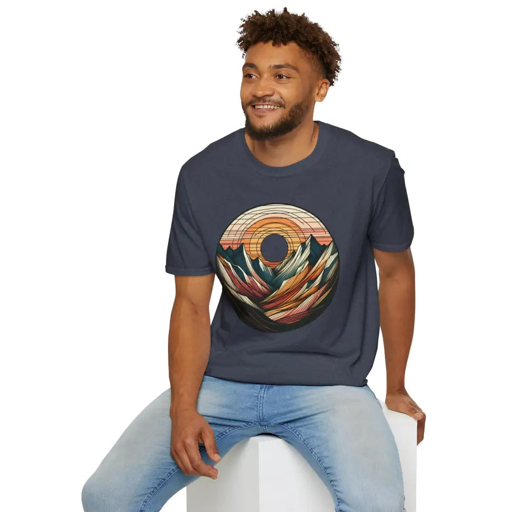 Man wearing a softstyle t-shirt designed with colorful mountain and sunset graphic, elastic ribbed collar