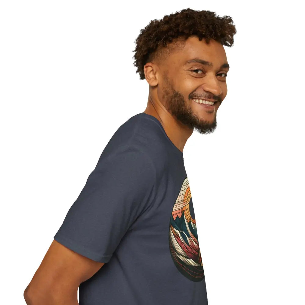 Smiling man wearing a vintage mountain vibes softstyle t-shirt with elastic ribbed collar