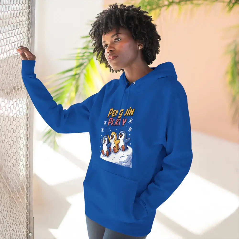 Woman wearing a blue Penguin Party hoodie made of cozy fleece, machine wash friendly, perfect for winter
