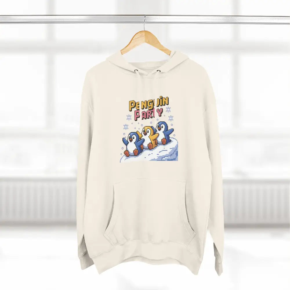Cream-colored hooded sweatshirt with Penguin Party graphic made from cozy fleece, machine washable