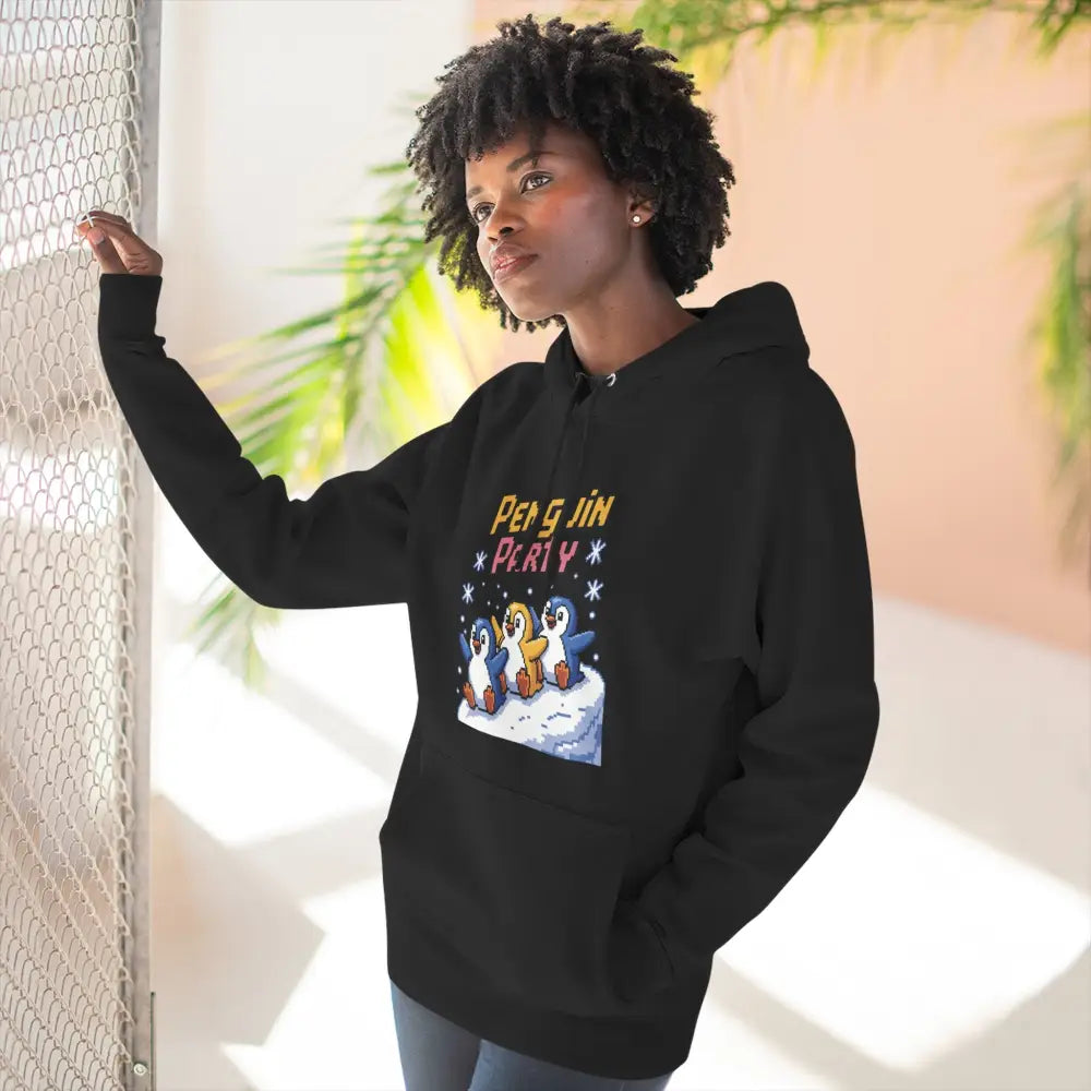 Black hoodie with colorful penguin graphic made from cozy fleece, machine washable, low heat care