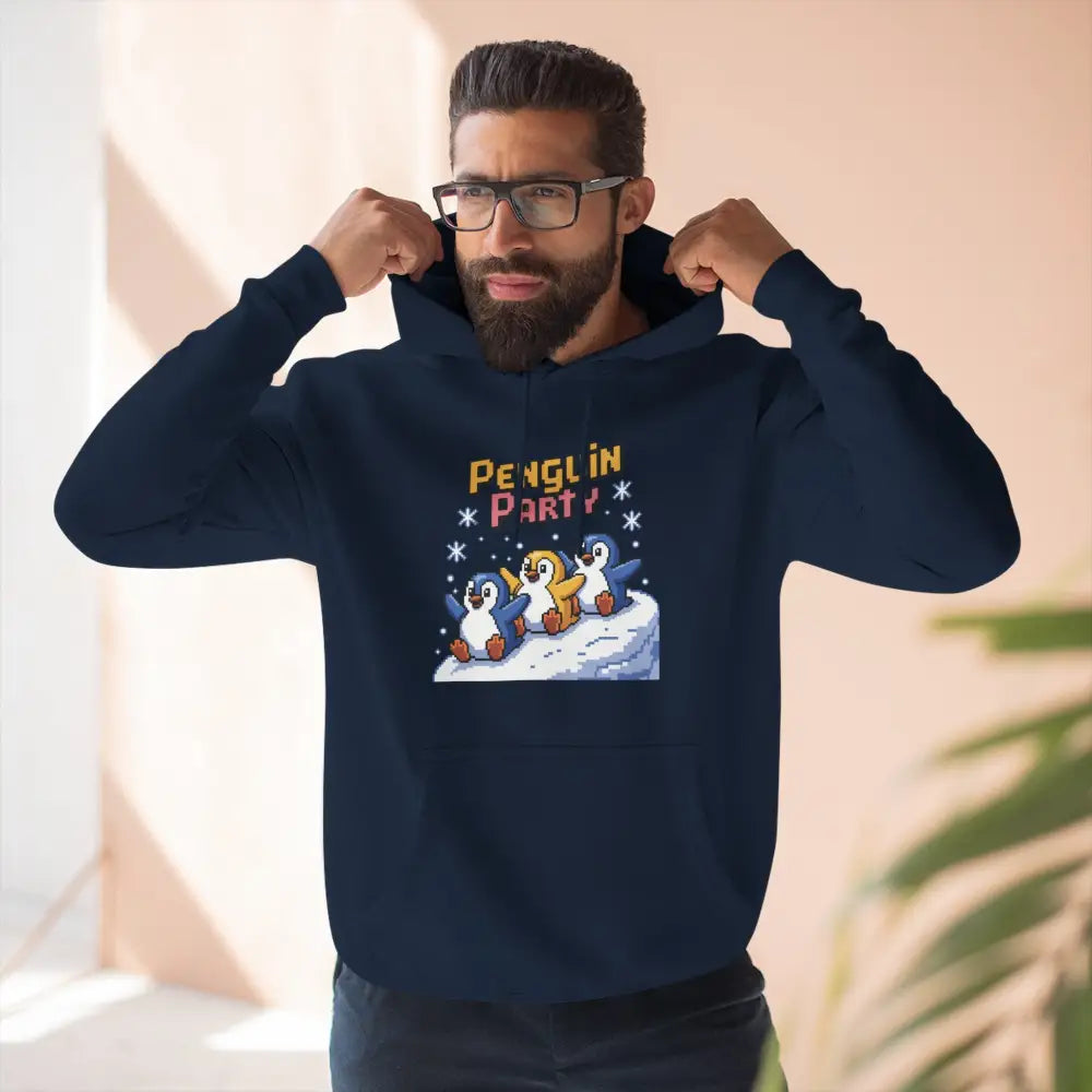 Man wearing a dark blue Penguin Party cozy fleece hoodie for winter celebrations and gift