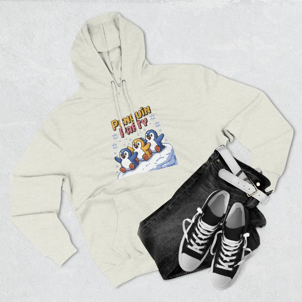 Cream-colored hooded sweatshirt with Penguin Party graphic made of cozy fleece, machine washable